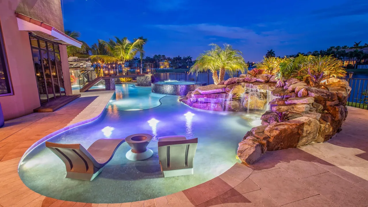 Family-friendly pool remodel with shallow entry and water features in Scottsdale