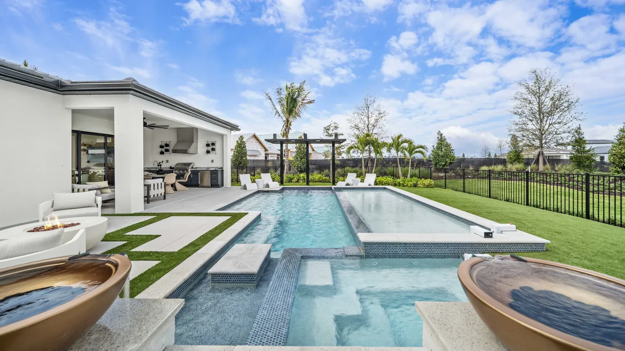 Modern geometric pool design with raised spa and contemporary landscaping