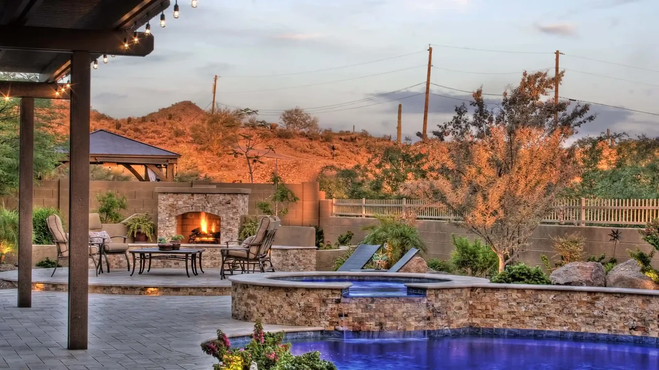 Resort-style backyard pool with fire features and spa in Arizona